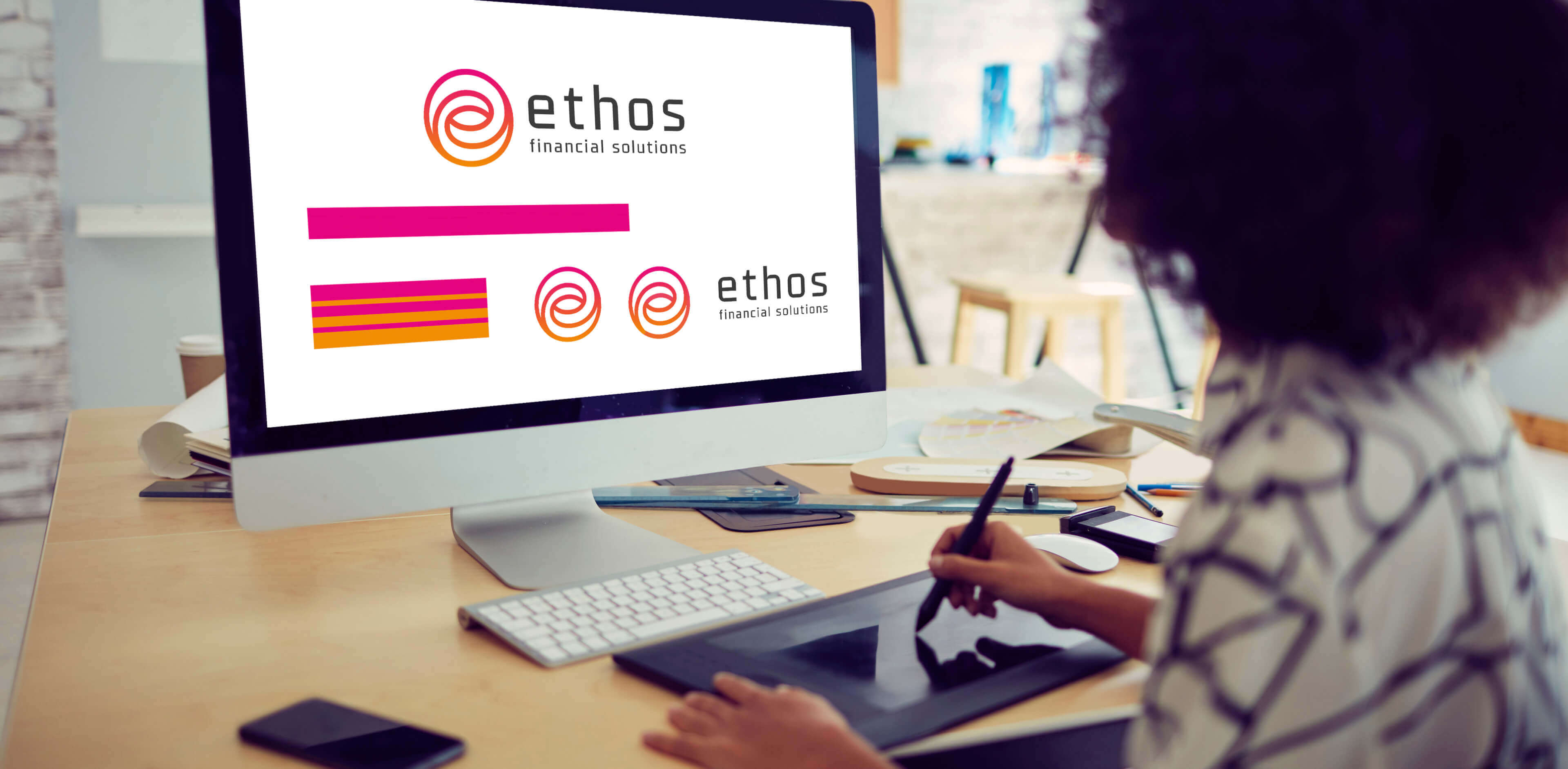 Ethos Logo design ideas on a laptop