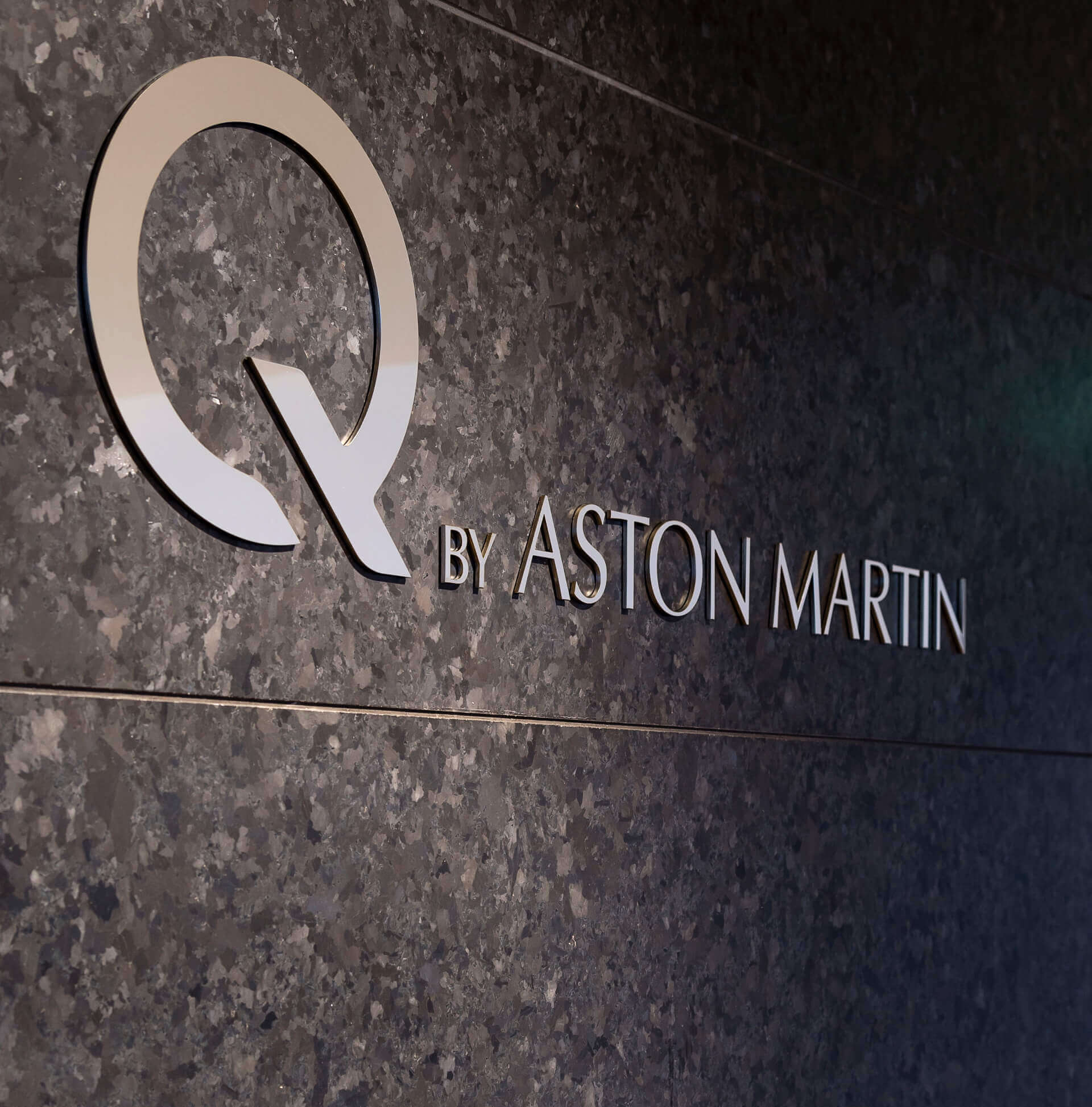 Q by Aston Martin Gold Wall Sign